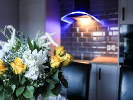 A flower arrangement on a table in a kitchen at Penrhos Walks in Holyhead