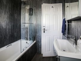 A bathroom with a bathtub and shower at Penrhos Walks in Holyhead