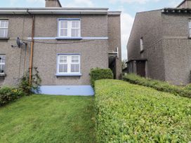 An exterior view of a building with windows and bushes at Burna in Letterkenny