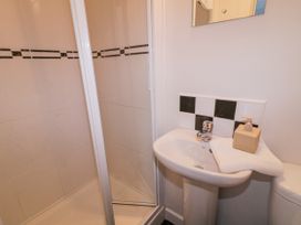 A bathroom with a shower and wash basin at Burna in Letterkenny