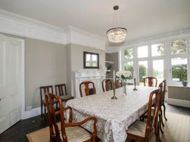 A dining room with a table and chairs at The Old Vicarage in Kimbolton near Leominster
