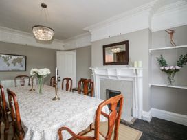 A dining room with a table and chairs at The Old Vicarage in Kimbolton near Leominster
