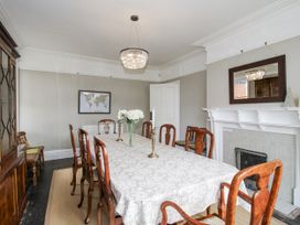 A dining room with a table and chairs at The Old Vicarage in Kimbolton near Leominster