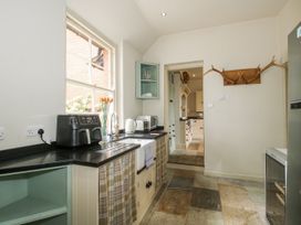 A kitchen with appliances and storage at The Old Vicarage Kimbolton near Leominster