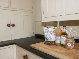 A kitchen counter with snacks and drinks at The Old Vicarage Kimbolton near Leominster