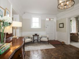 An entrance hall with a sofa and chairs at The Old Vicarage in Kimbolton near Leominster