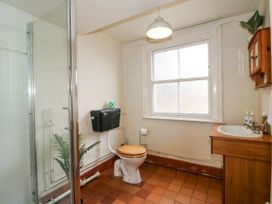 A bathroom with a shower, toilet, and sink at The Old Vicarage in Kimbolton near Leominster