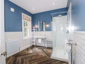 A bathroom with a shower and sink at The Old Vicarage in Kimbolton near Leominster