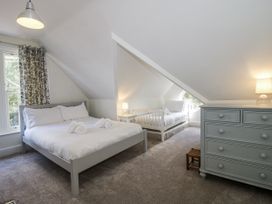 A bedroom with a double bed and a single bed at The Old Vicarage in Kimbolton near Leominster