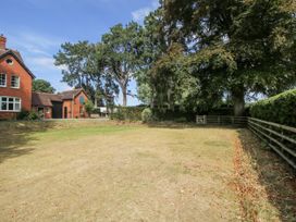 A garden with grass and trees at The Old Vicarage Kimbolton near Leominster