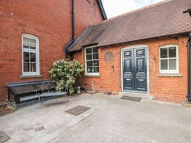 An entrance area with a bench and plants at The Old Vicarage in Kimbolton near Leominster