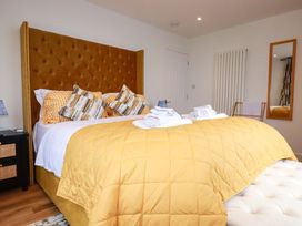 A bedroom with a bed and pillows at Ocean Edge in Sennen Cove