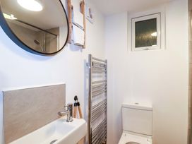 A bathroom with a sink and a toilet at Ocean Edge in Sennen Cove