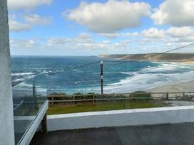 A view of the ocean with waves at Ocean Edge in Sennen Cove