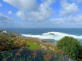 An ocean view with coastline and houses at Ocean Edge Sennen Cove