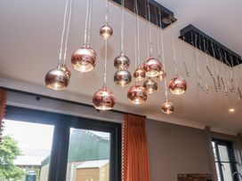 A ceiling with hanging lights in Holly Farm near Brantham