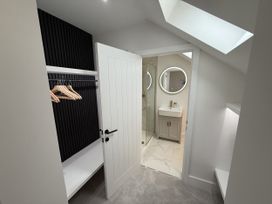 A bathroom with a shower and sink at Bader House in Ipswich