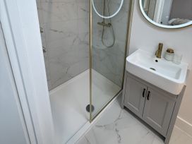 A shower and sink in a bathroom at Bader House Ipswich