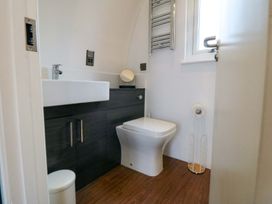 A bathroom with a sink and toilet at Bumblebee Glamping Pod in Malton