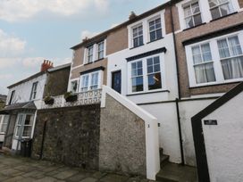 A street view of houses with stairs and door at 5 Llewelyn Street in Conwy