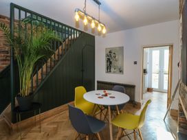 A dining area with a table and chairs at Ty Gelert in Conwy