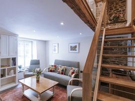 A living room with a sofa and coffee table at Bluck's cottage in St. Agnes