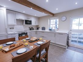 A kitchen with table and breakfast items at Bluck's cottage in St. Agnes