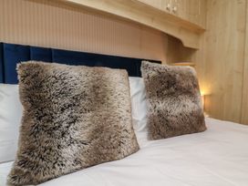 A bedroom with pillows on the bed at Big Bertha by the Sea, Northam