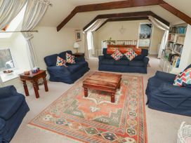 A living room with sofas and a coffee table at Honeymug in Branton near Powburn