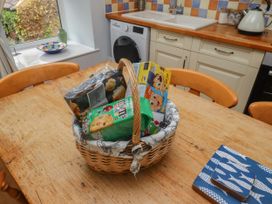 A basket with food items on a table at Honeymug in Branton near Powburn