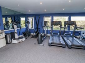 A gym with treadmills and exercise equipment at Honeymug in Branton near Powburn