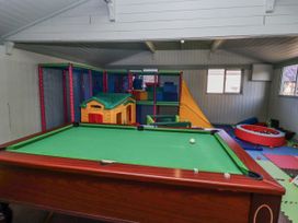 A playroom with a pool table and soft play equipment at Honeymug in Branton near Powburn