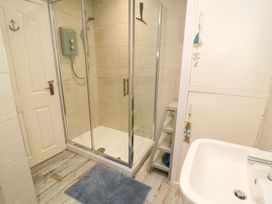 A bathroom with a shower and sink at Beach House