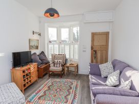 A living room with a sofa and armchair at 1 Castle Terrace