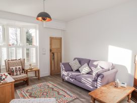 A living room with a sofa and armchair at 1 Castle Terrace