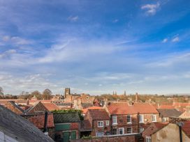 A view of rooftops and buildings under a blue sky at 1 Castle Terrace