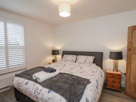 A bedroom with a bed and bedside table at 1 Castle Terrace in Thirsk