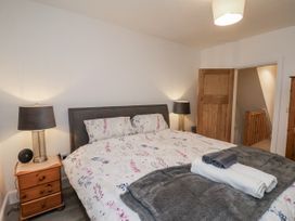 A bedroom with a bed and bedside table at 1 Castle Terrace in Thirsk