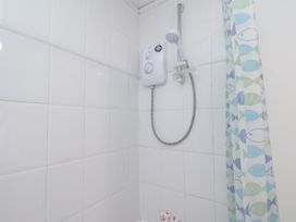 A shower setup with tiles and control at 1 Castle Terrace in Thirsk