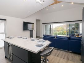 A kitchen with an island and a sofa at Cottage 1 in Laugharne