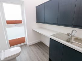 A bathroom with a sink and toilet at Cottage 1 in Laugharne