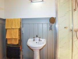 A bathroom with a sink and towel rail at Tradewinds in Newquay