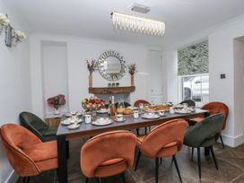 A dining room with a table set for a meal at Aspen Boutique