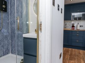 A bathroom with a shower and sink at Aspen Boutique in 