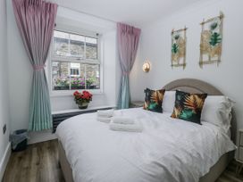A bedroom with a bed and window at Aspen Boutique in 