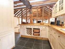 A kitchen with cabinets and countertop at WEST LODGE in Ashford