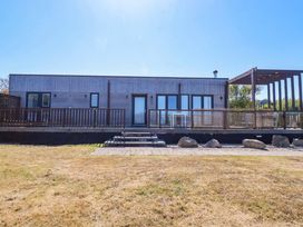 A house with a deck and steps at Gwel An Mor in Portreath