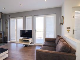A living room with a sofa and television at Gwel An Mor Portreath
