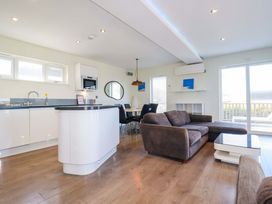A kitchen with a sofa and dining area at Gwel An Mor Portreath