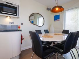 A dining room with table and chairs at Gwel An Mor in Portreath